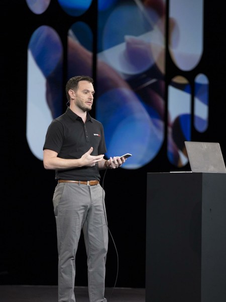 Jerry on stage with phone at Knowledge keynote