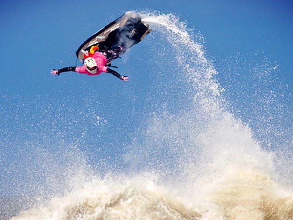 No-hand barrel roll on a jetski — blue sky