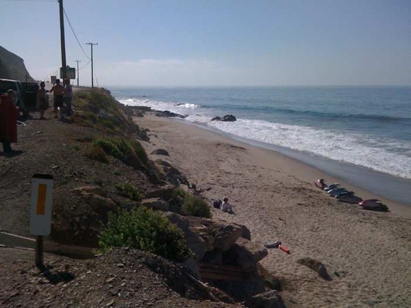 Lowered down a 15 ft cliff, skis are on the beach